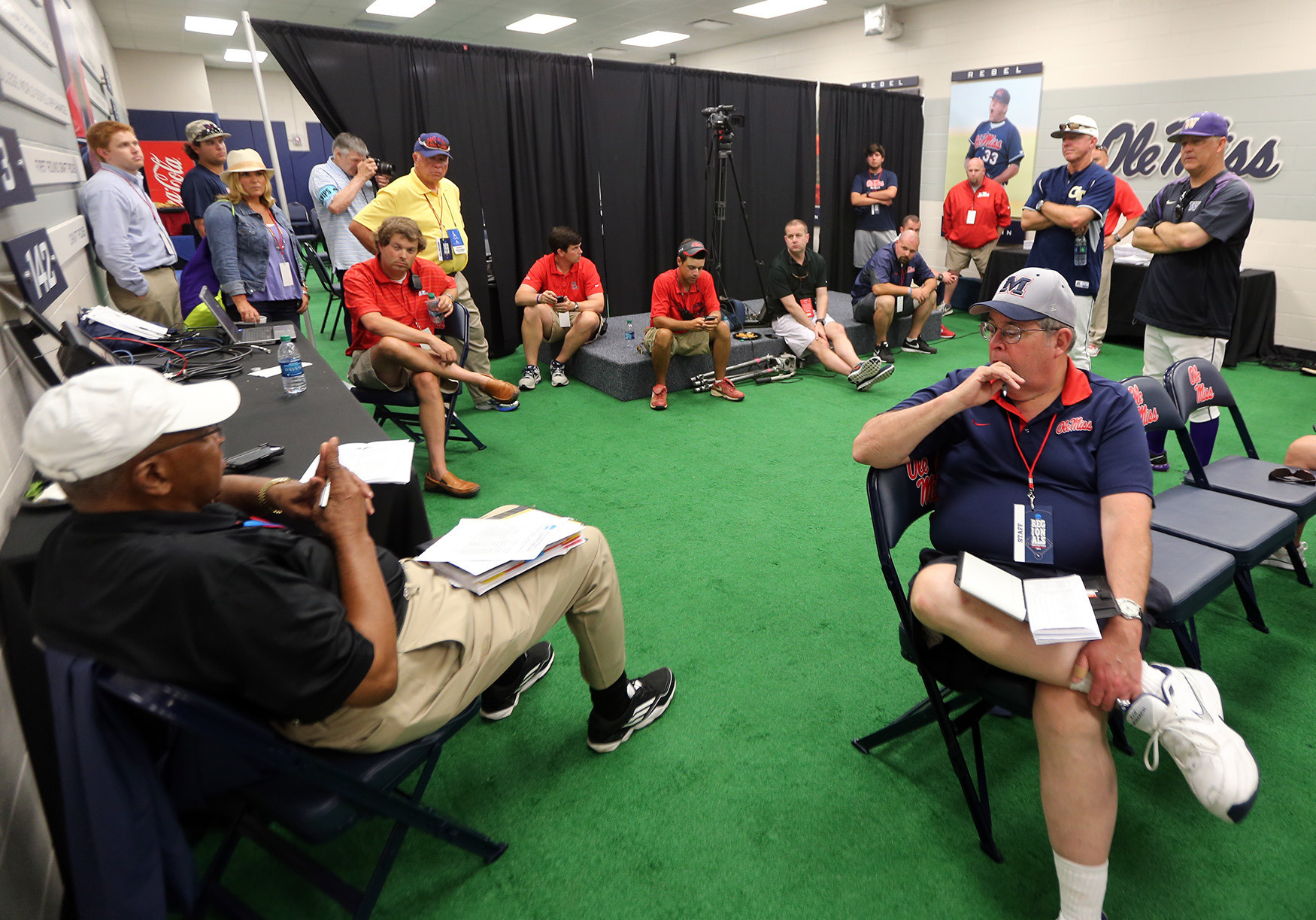 NCAA officials meet to discuss the plan during the rain delay (Photo by Josh McCoy)