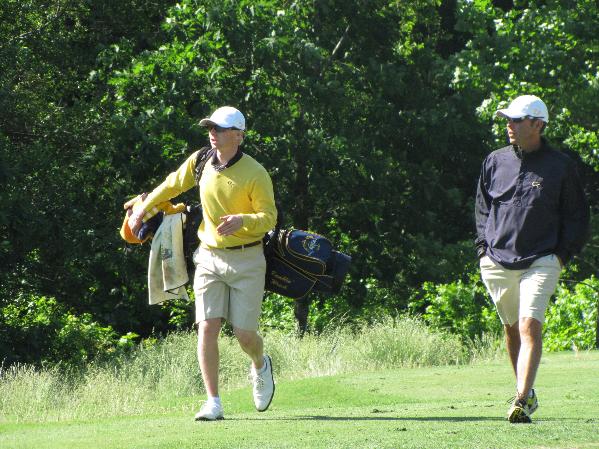 Anders Albertson and assistant coach Brennan Webb walk off the 2nd tee during the final round of the NCAA Raleigh Regional.
