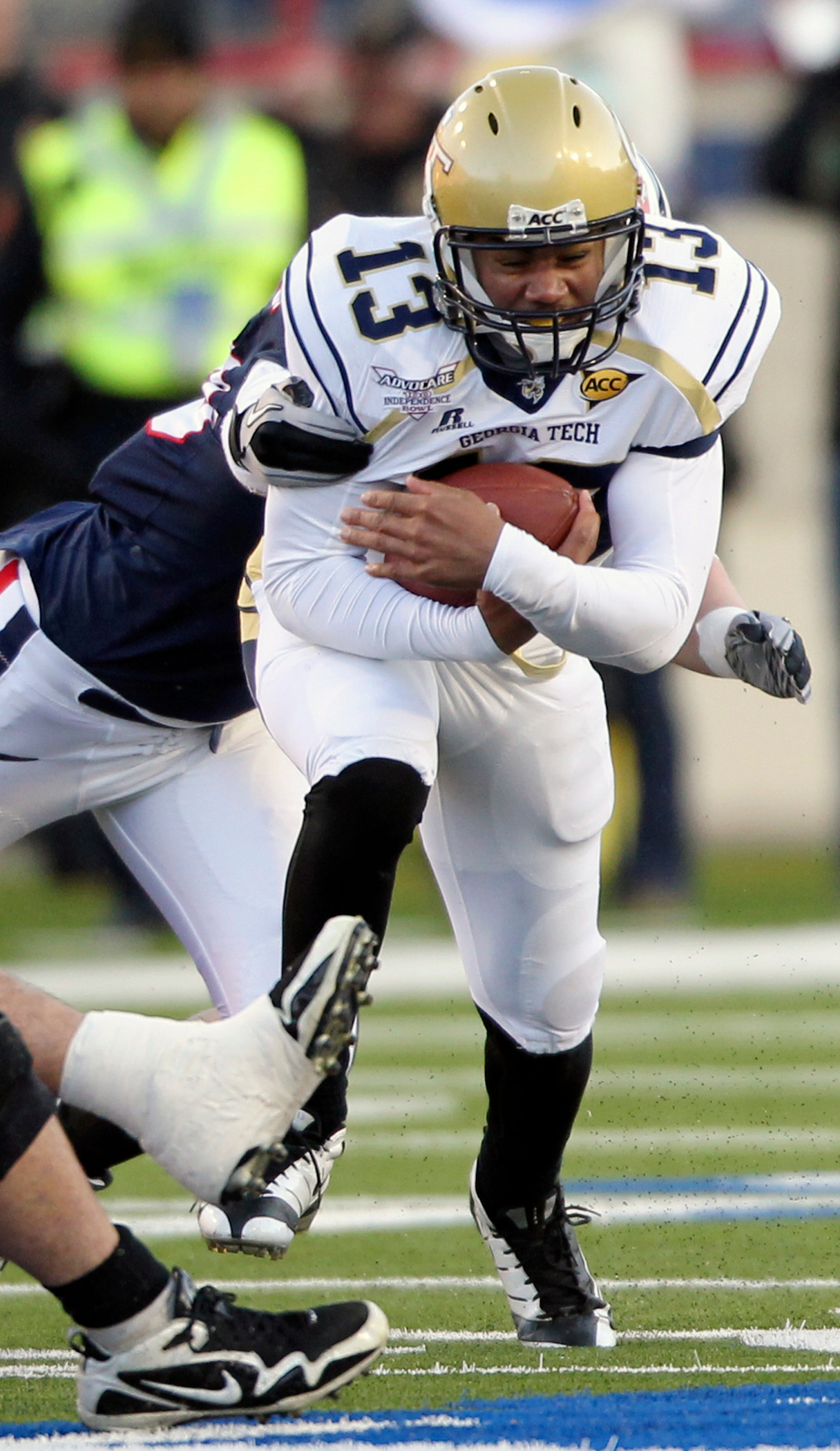 Georgia Tech quarterback Tevin Washington (13) runs for a short first quarter gain against Air Force in the during their NCAA college football bowl game at the Independence Bowl in Shreveport, La., Monday, Dec. 27, 2010. (AP Photo/Rogelio V. Solis)