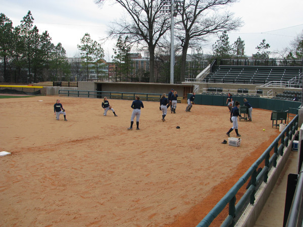 Softball team practices in its new stadium for the first time.