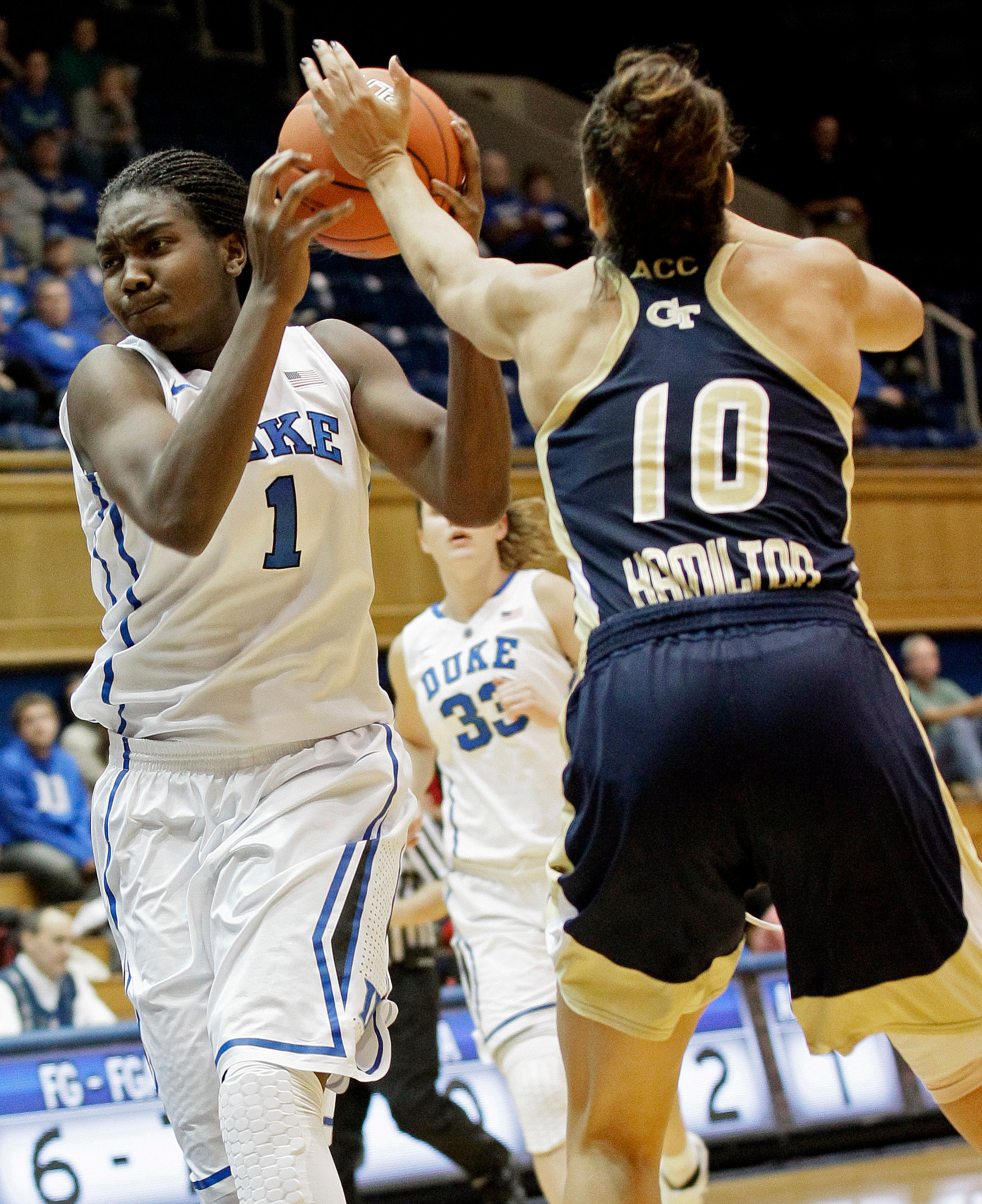 Duke's Elizabeth Williams (1) drives to the basket against Georgia Tech's Danielle Hamilton-Carter (10) during the second half of an NCAA college basketball game in Durham, N.C., Thursday, Dec. 6, 2012. Duke won 85-52. (AP Photo/Gerry Broome)