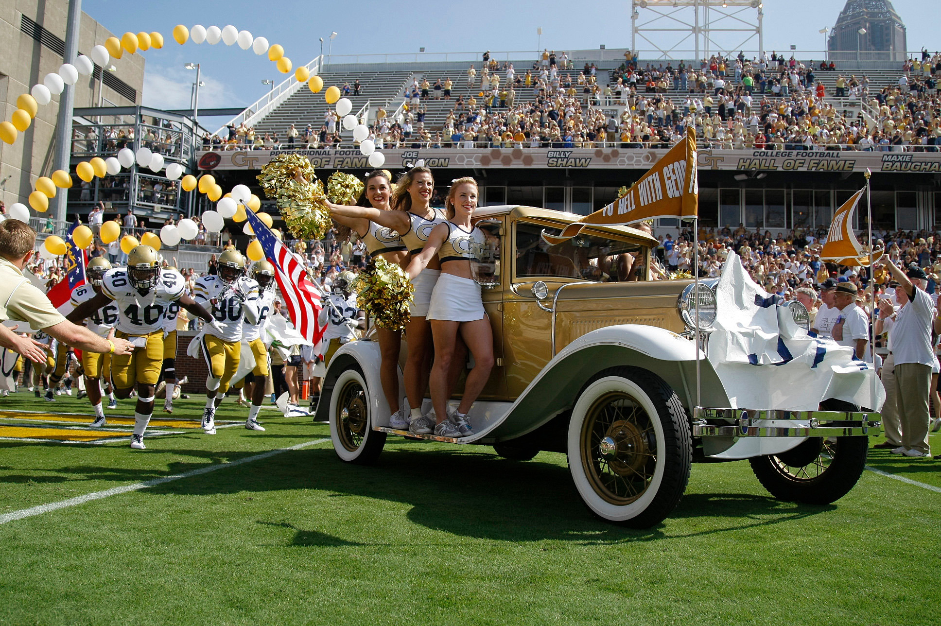 Yellow Jackets mascot the Ramblin Wreck and cheerleaders lead the team on the field before a game against the Duke Blue Devils at Bobby Dodd Stadium. (Brett Davis-USA TODAY Sports)