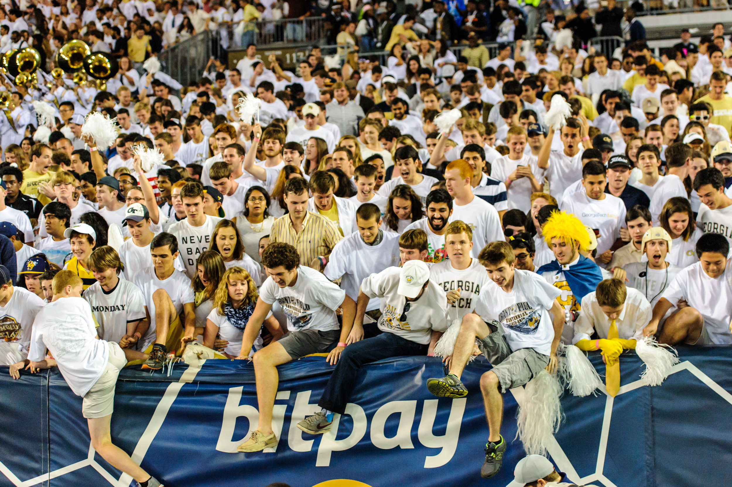 Fans stream over the walls towards the field