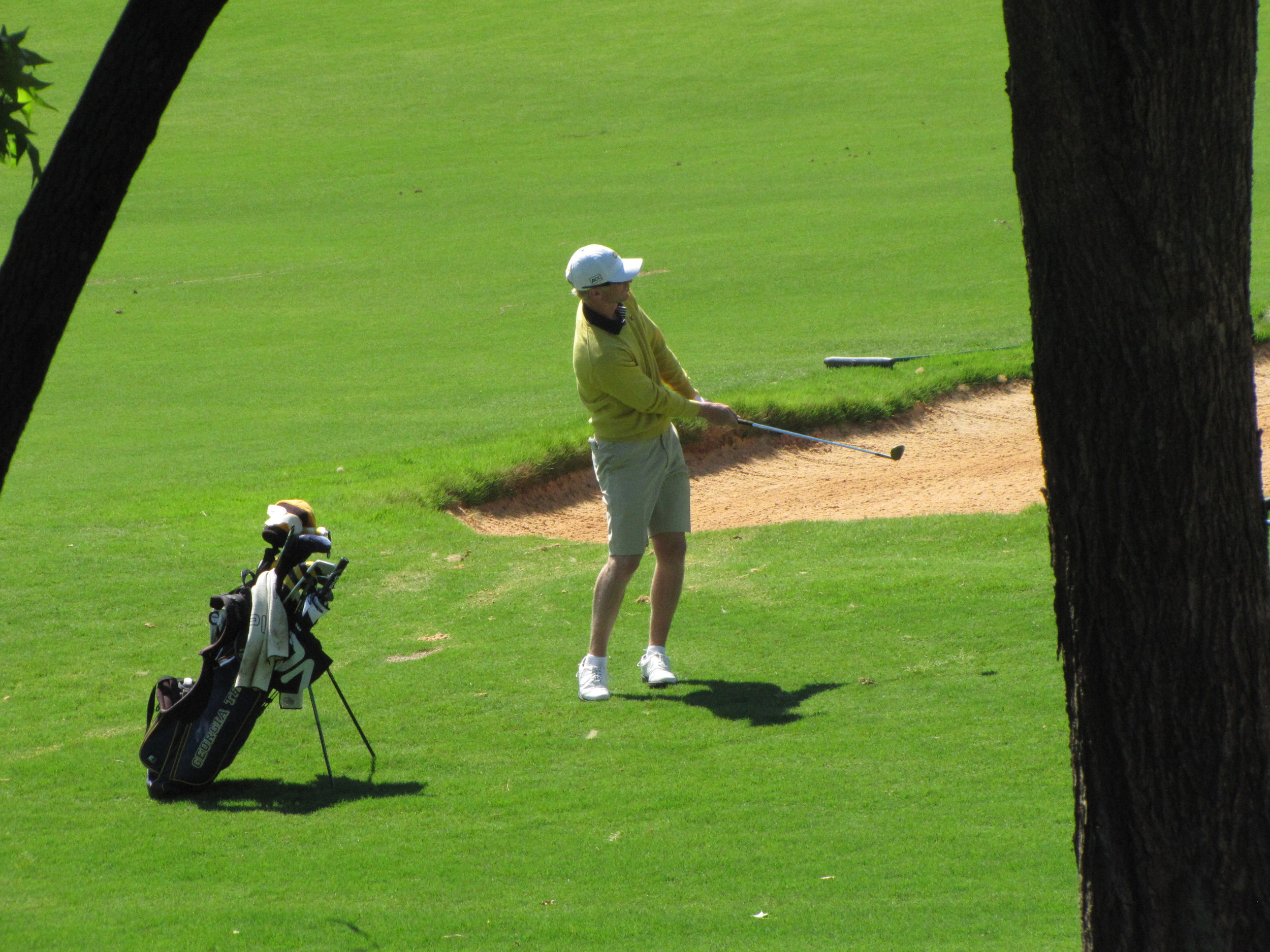 Anders Albertson chips up to the 5th green during the final round of the NCAA Raleigh Regional.