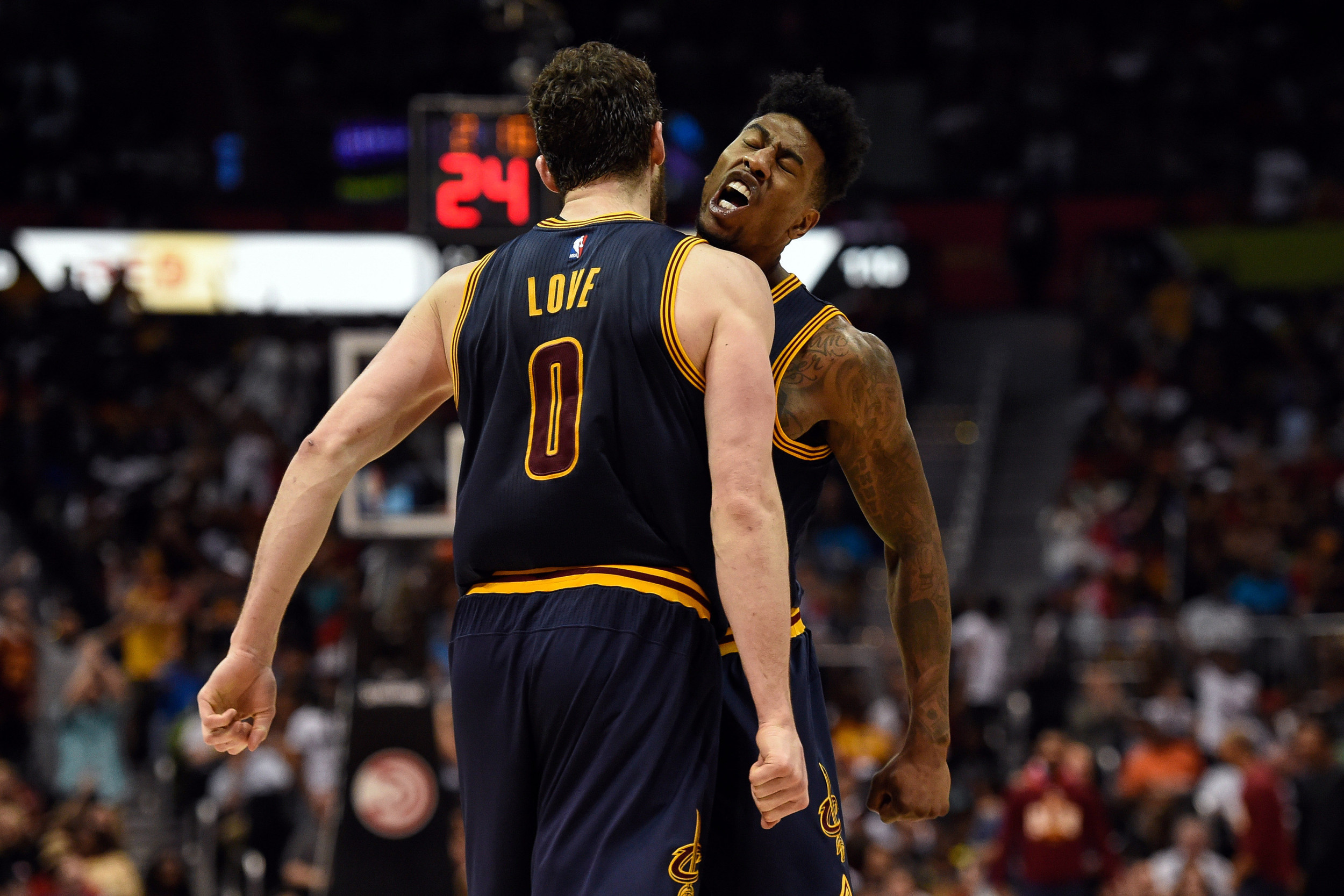 May 8, 2016; Atlanta, GA, USA; Cleveland Cavaliers forward Kevin Love (0) and guard Iman Shumpert (4) reacts after a basket against the Atlanta Hawks during game four of the second round of the NBA Playoffs. The Cavaliers defeated the Hawks 100-99. Credit: Dale Zanine-USA TODAY Sports