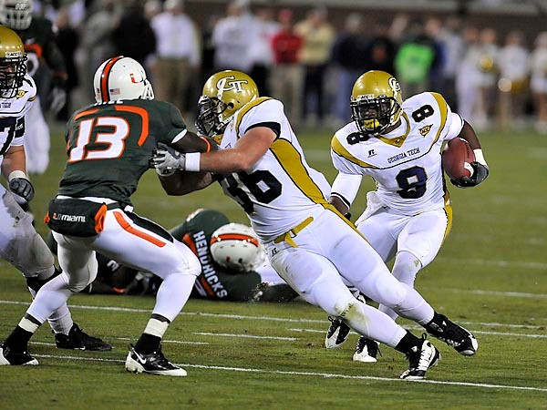 Demaryius Thomas (8) follows the blocking of Lucas Cox (36). (Photo by LensEffects)