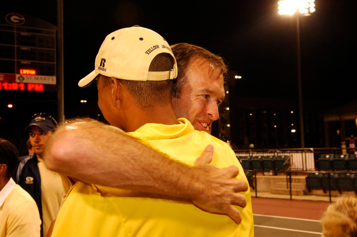 Bryan Shelton gets a congratulatory hug from his former doubles partner, Tech men's coach Kenny Thorne.