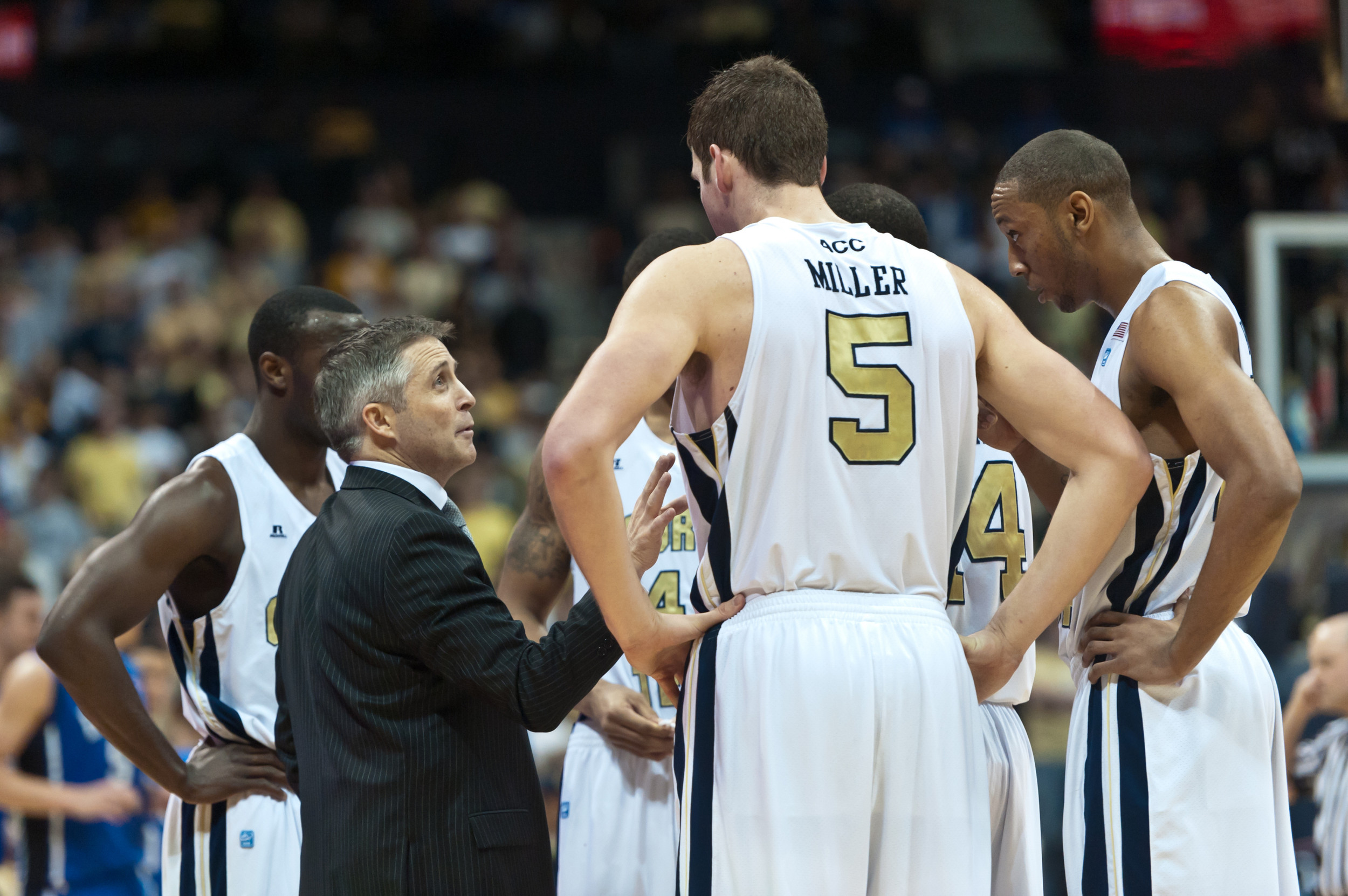 Coach Brian Gregory speaks to the team.