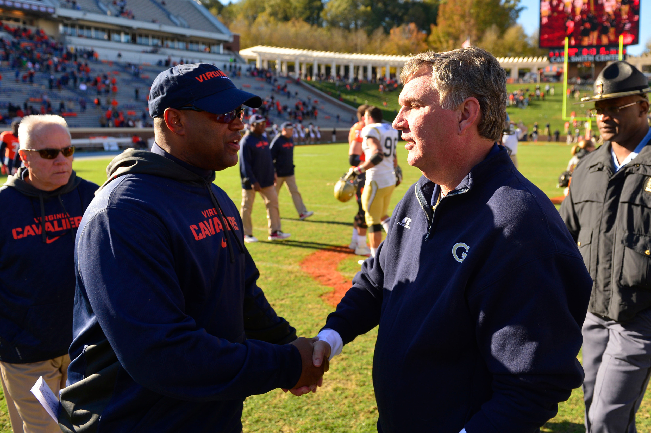 Virginia Cavaliers head coach Mike London shakes hands with Georgia Tech Yellow Jackets head coach Paul Johnson after the game. Mandatory Credit: Bob Donnan-USA TODAY Sports