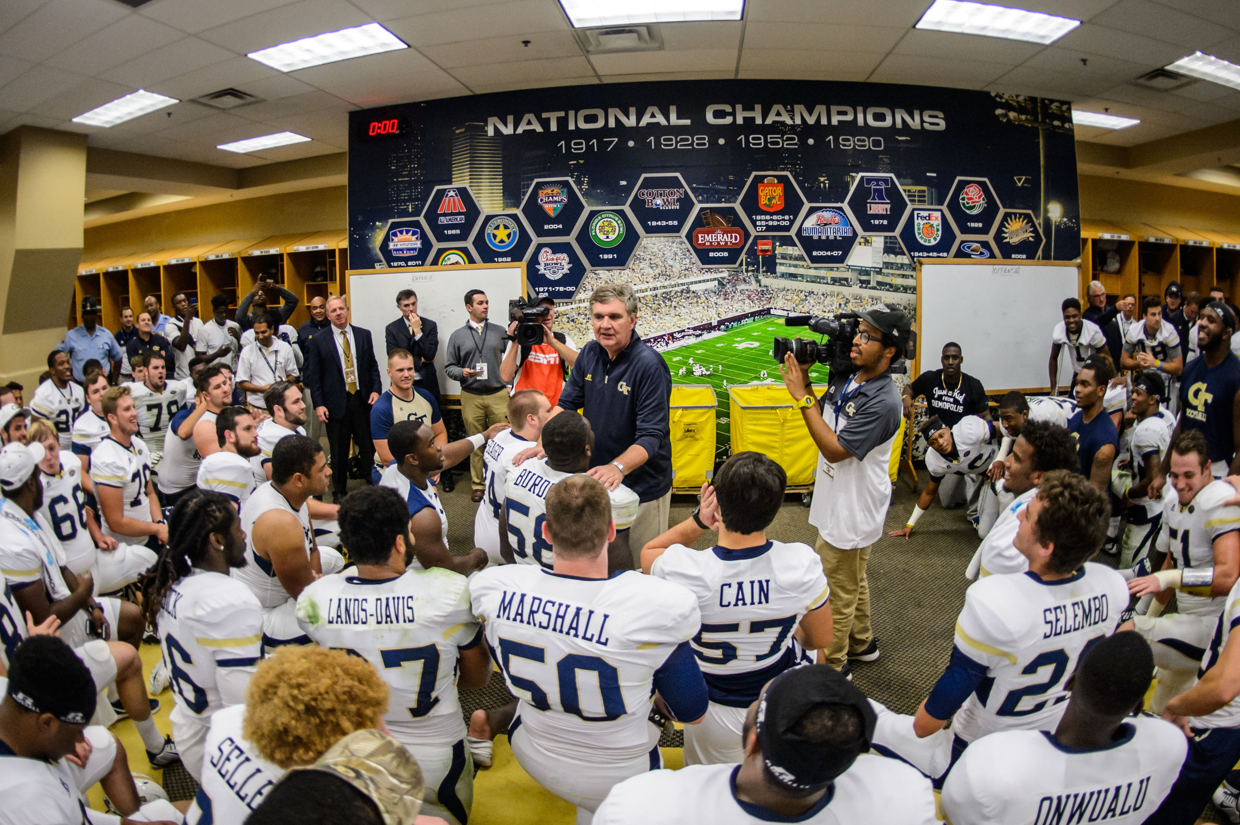 Coach Paul Johnson talks to the team after the upset victory