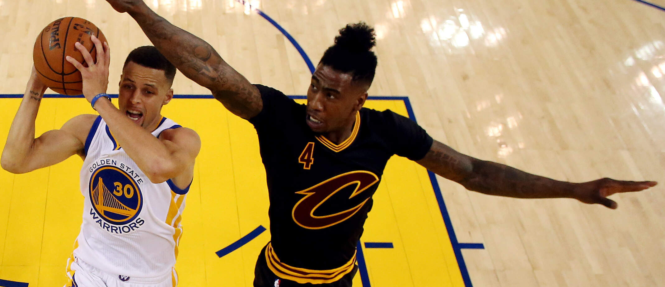 Jun 13, 2016; Oakland, CA, USA; Golden State Warriors guard Stephen Curry (30) shoots the ball against Cleveland Cavaliers guard Iman Shumpert (4) forward LeBron James (23) in game five of the NBA Finals. Credit: Ezra Shaw-Pool Photo via USA TODAY Sports