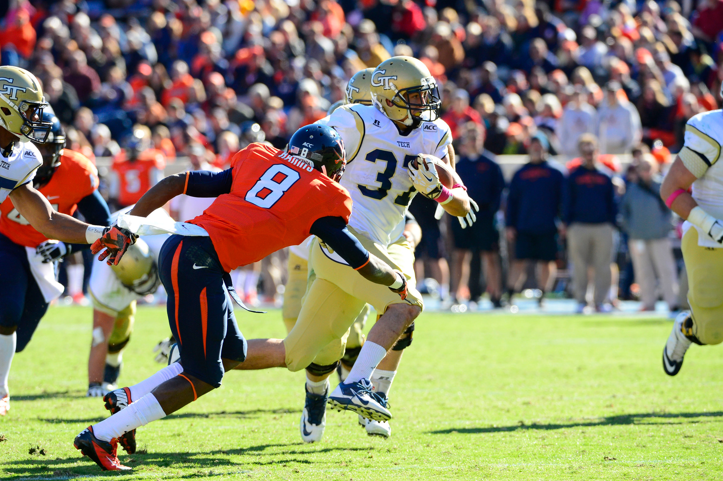 Zach Laskey (37) runs as Virginia Cavaliers safety Anthony Harris (8) defends in the third quarter. Mandatory Credit: Bob Donnan-USA TODAY Sports