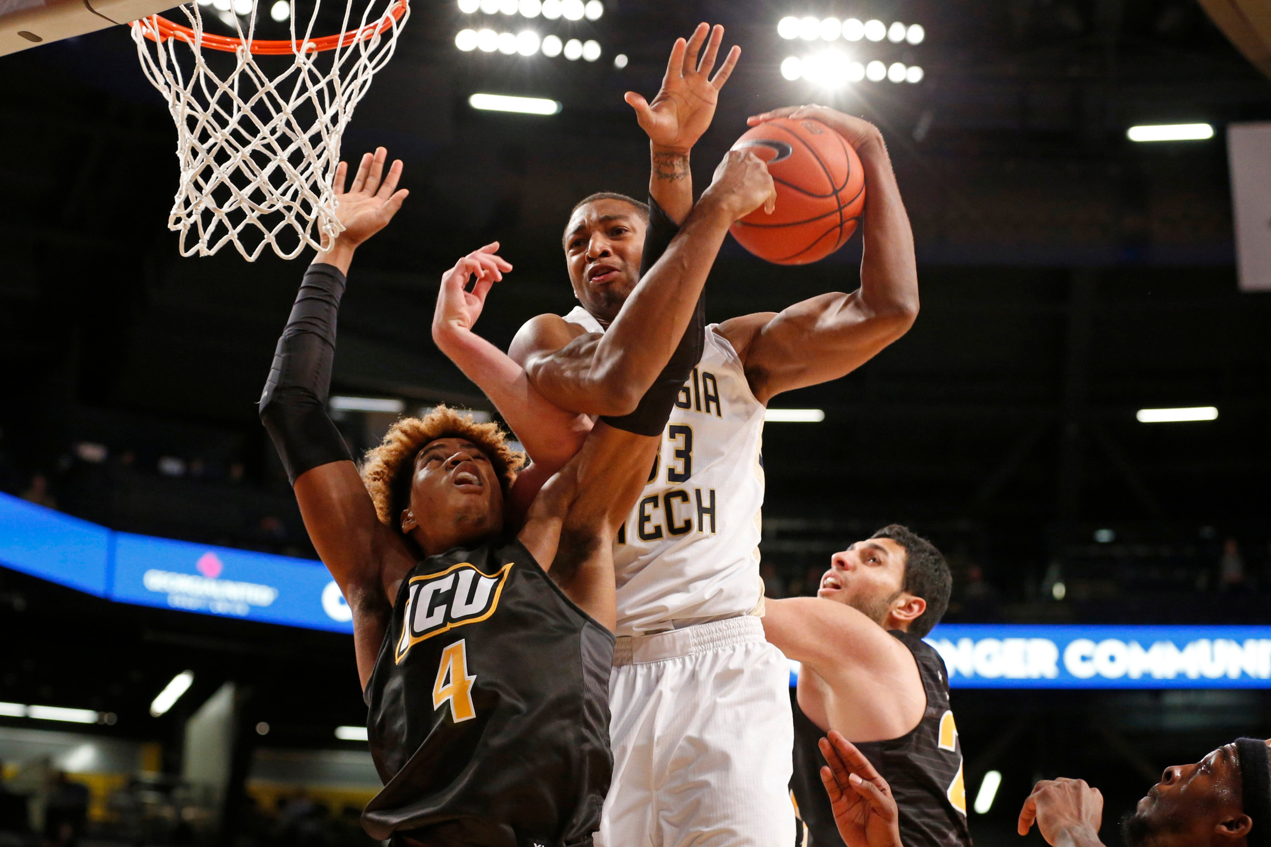 Georgia Tech forward James White grabs a rebound against VCU Rams forward Justin Tillman in the first half of their game at McCamish Pavilion. Credit: Jason Getz-USA TODAY Sports