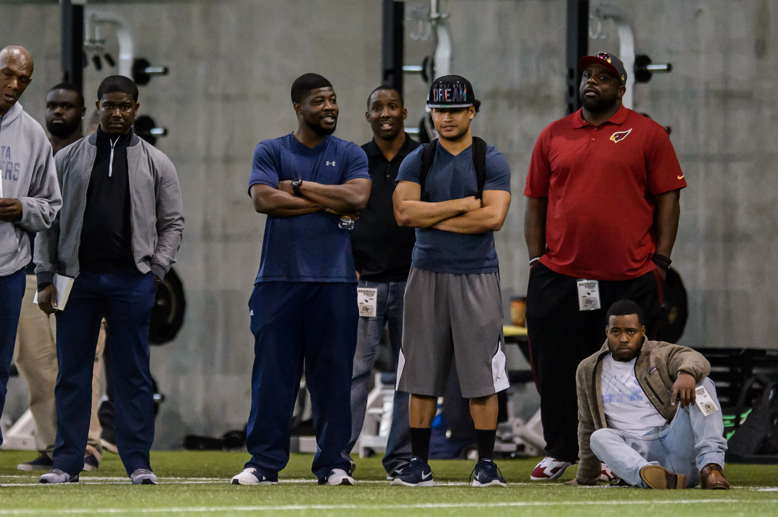 Assistant Coach Lamar Owens, Joe Hamilton, Justin Thomas, and Tony Zenon watch former Georgia Tech players participate in Pro Day