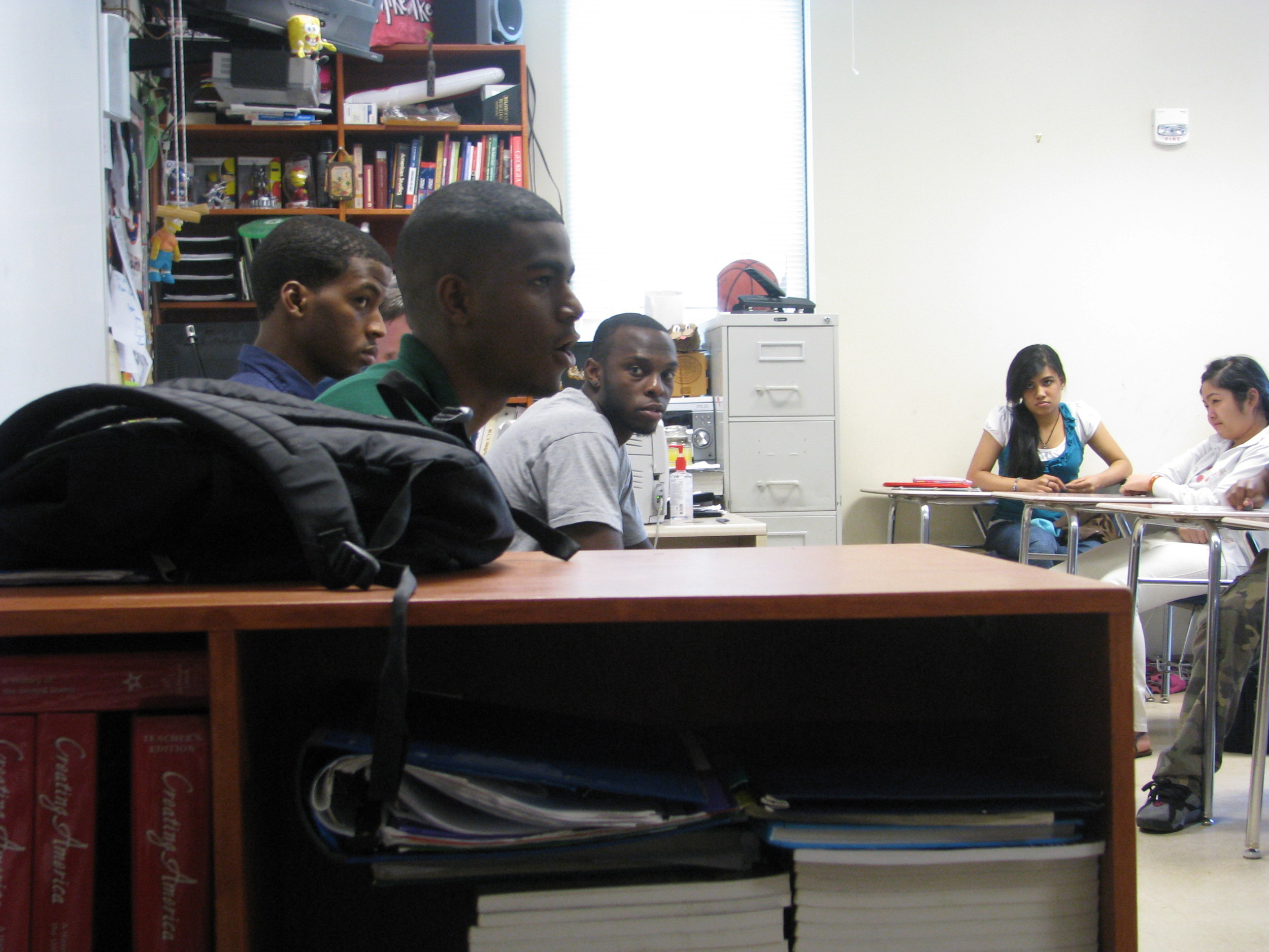 Mfon Udofia joins other college students from the area to speak to Tucker Middle School students about college life and preparing for college.