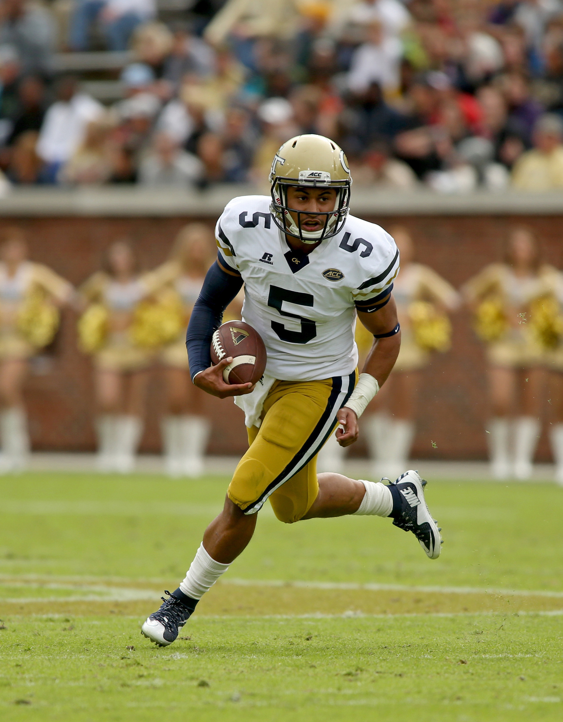 Justin Thomas runs in the first quarter. Jason Getz-USA TODAY Sports