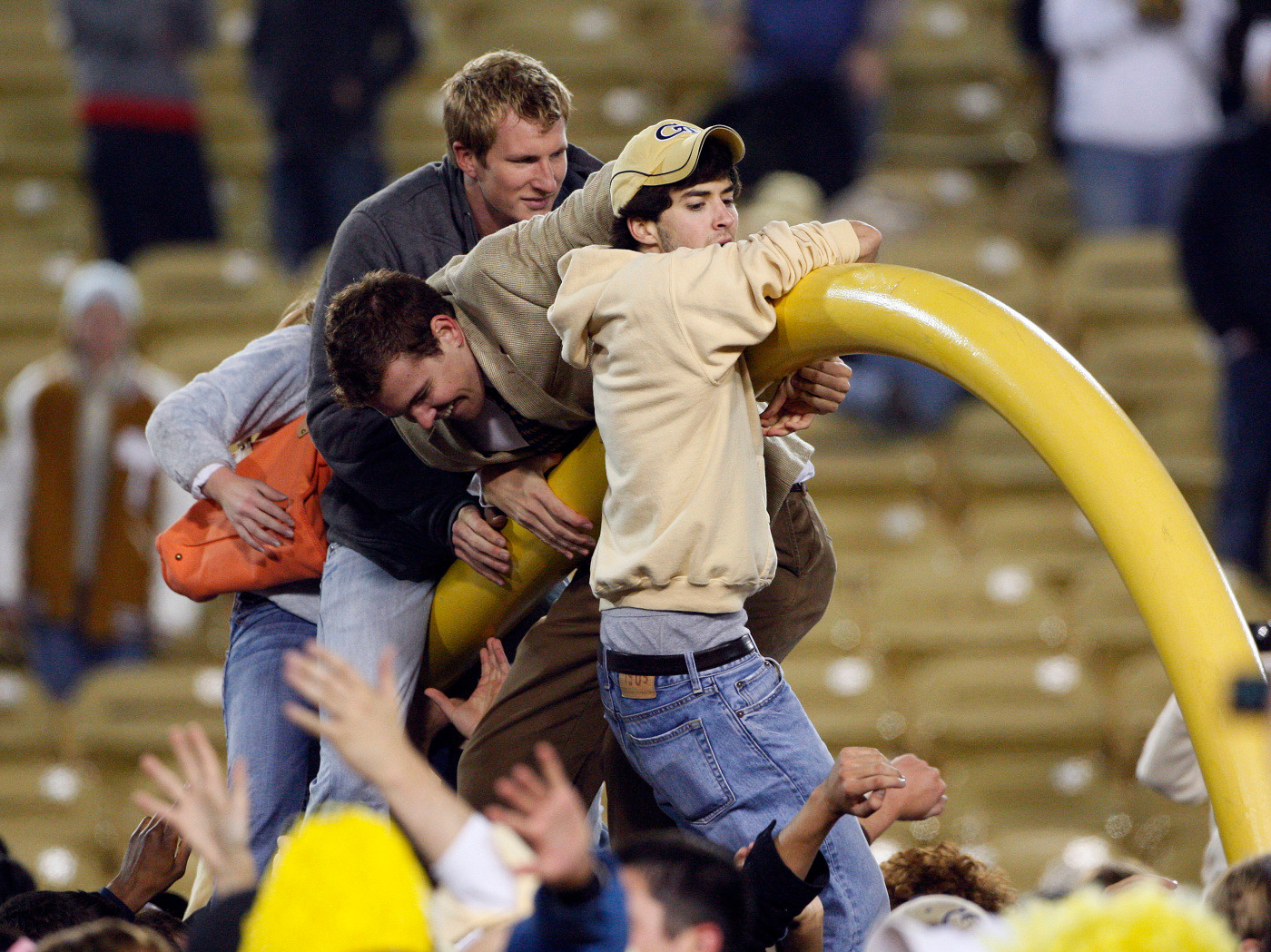 Georgia Tech students tear down the goalpost after the Yellow Jackets' 28-23 win over Virginia Tech in an NCAA college football game in Atlanta, Saturday, Oct. 17, 2009. (AP Photo/John Bazemore)
