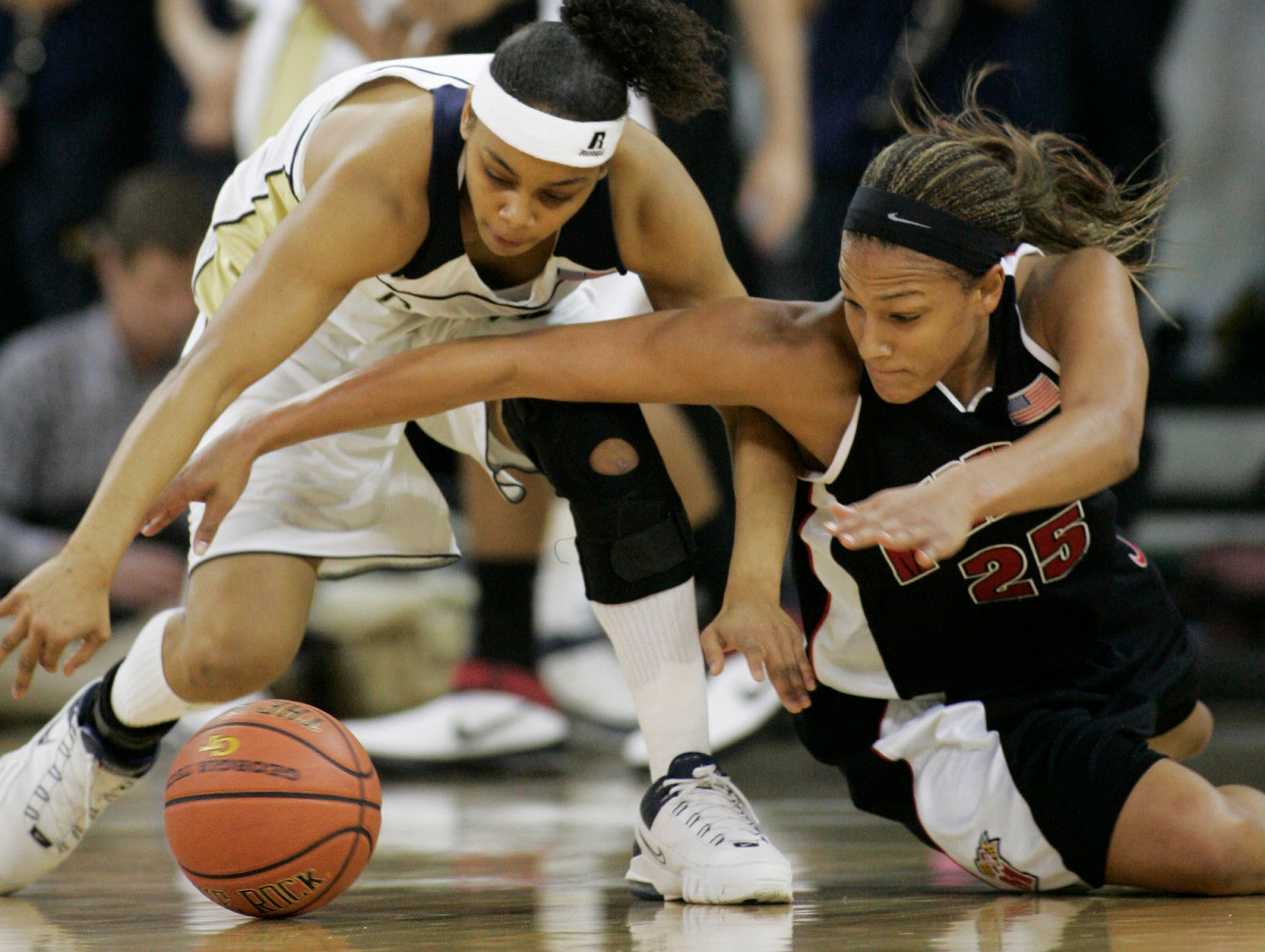 Georgia Tech guard Jill Ingram, left, and Maryland Marissa Coleman (25) battle on the floor for a loose ball during the first half of their women's basketball game in Atlanta, Thursday, Febuary 1, 2007, in Atlanta. (AP Photo/John Amis)