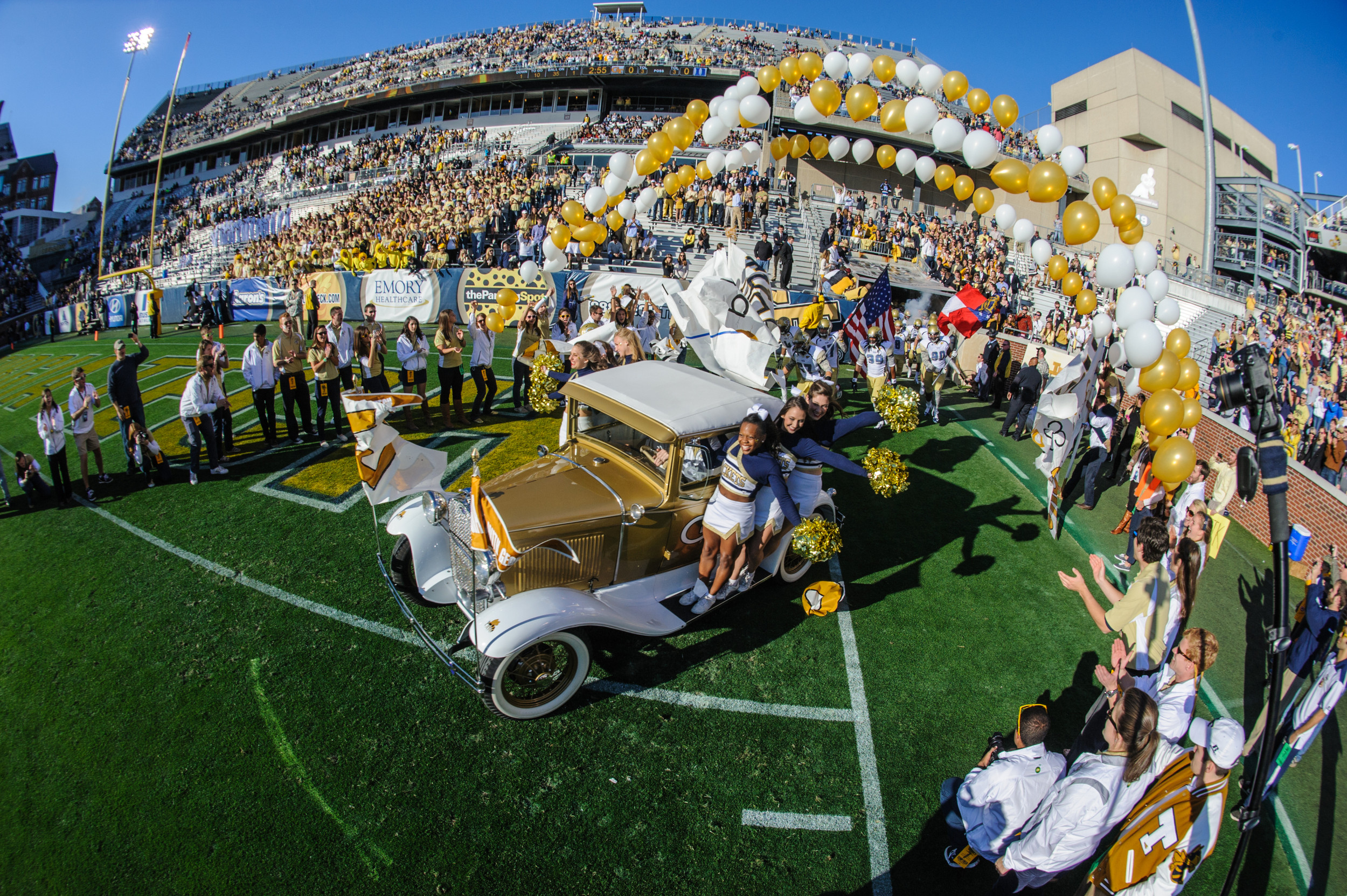 The Ramblin' Reck leads the team onto the field.